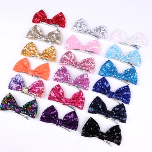 Detail showing the metal alligator clip and dense colorful sequins on 4-inch hair bows