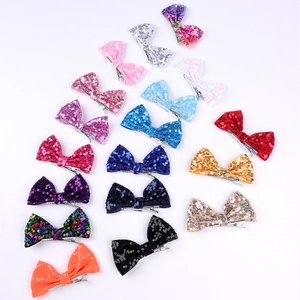 Close-up of a 16-color set of glitter sequin hair bows with metal alligator clips