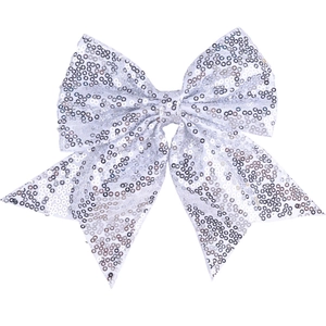 Macro detail of a large silver sequin bow hair clip with reflective sparkling embroidery