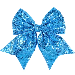 Detailed close-up of blue sequined bow hair clip with embroidery for girls