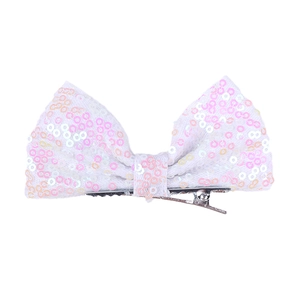 Detailed view of 4-inch white sequin bow hair clip with shimmering iridescent glitter effect