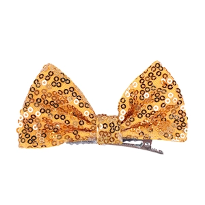 Detail view of a 4-inch bright gold sequin hair bow with a metal alligator clip