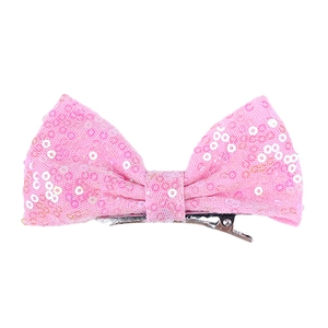 Detail view of a 4-inch pink sequined bow hair clip with a sturdy metal alligator grip