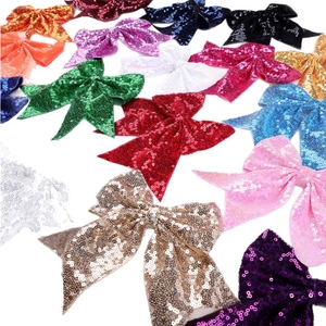 Colorful sequin bow hair clips for girls in various bright colors like red pink and blue