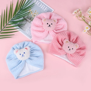 Soft baby waffle knit hats with cute teddy bear dolls in blue and pink pastel colors