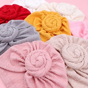 Knitted infant turban hats with large 3D rose flower knots in various pastel colors