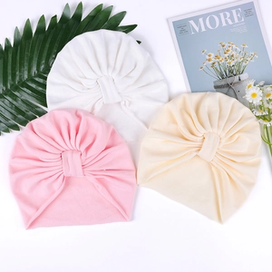 Thick cotton baby hats for fontanelle protection in white, pink and beige tones