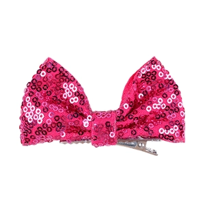 Detail of 4-inch sequin hair bow showing pink and white sequins and silver alligator clip