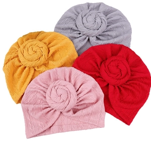 Pack of 4 infant turban hats with top flower knots in grey, yellow, pink, and red colors