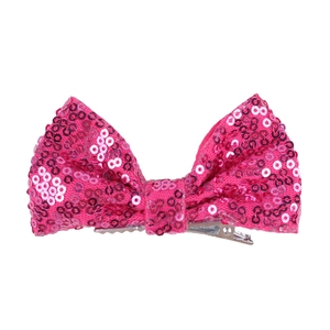 Detail of pink sequin hair bow showing the sparkly fabric and silver metal clip