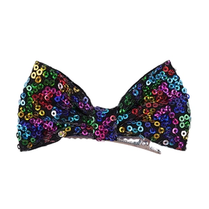 Detail of 4 inch hair clip with vibrant multicolored sequins on metal alligator base
