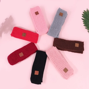 Vertical ribbed knit ear warmers with premium leather labels in seven varied colors