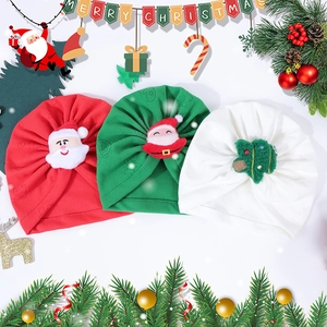 Three infant Christmas turbans in red, green, and white with 3D festive plush ornaments