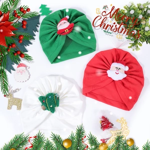 Three-piece set of Christmas themed baby beanies with Santa Claus and tree details