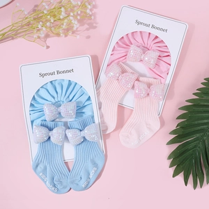 Set berretto e calzini in cotone per neonati con fiocco di paillettes in blu e rosa