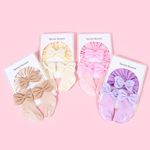 Detailed set of cotton baby headband with bow and matching socks in four pastel colors