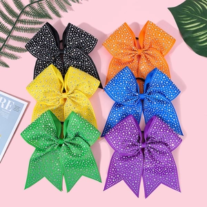 Detail of vibrant grosgrain bow hair clips with crystal rhinestones in six bright colors