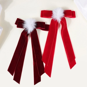 Elegant velvet bow hair clips with white pom-poms and long ribbons in red colors
