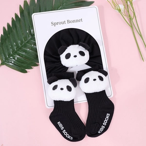 Detail view of cotton baby headband and socks set with cute 3D plush panda decorations