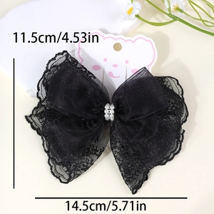 Detail view of 14.5cm black lace bow hair clip with faux pearls and mesh layering