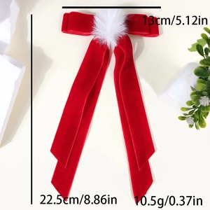 Detail view of red velvet bow hair clip with white pompom showing product dimensions