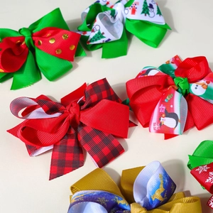 Detailed view of multilayer Christmas hair clips with festive reindeer and snowflake patterns