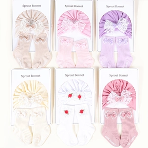 Six sets of cotton baby turbans and matching socks with lace bows in assorted colors