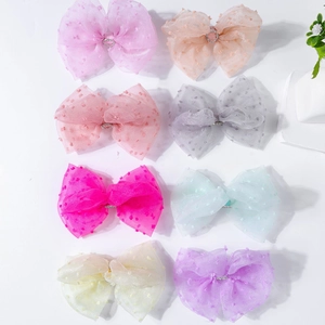 Detail of 8 colors mesh hair bows with flocked polka dots and sparkling rhinestone center