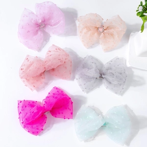 Detail of 6pcs colorful organza bow hair clips with flocked polka dots and diamond buckles