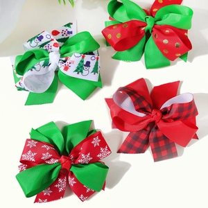 Detail of Christmas themed bow hair clips with snowflake and reindeer patterns