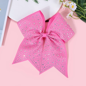 Detail of a pink grosgrain bow hair tie with sparkling rhinestones for girl hair accessories