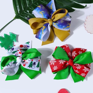 Three-piece Christmas ribbon hair bow set with festive elk snowman and snowflake prints