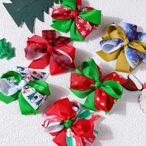 Set of six Christmas themed ribbon bow hair clips with reindeer and snowflake patterns