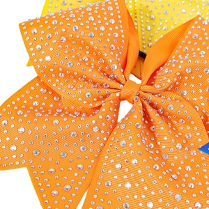 Classic orange cheer bow hair clip with sparkling rhinestones for girls and party wear