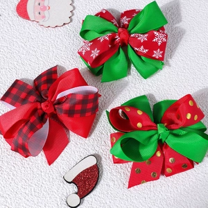 Three-piece Christmas bow hair clips set with snowflake, plaid, and polka dot patterns