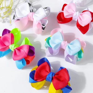 Detail shot of multi-colored double layered grosgrain ribbon bow clips for hair