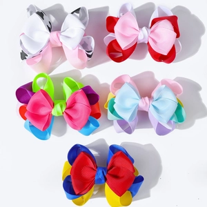 Detailed view of 5-piece multilayered grosgrain ribbon bow clips in vibrant colors