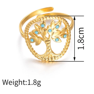 Detail of adjustable gold tree of life ring with blue turquoise inlay and relief craft