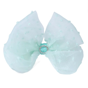 Detail of mint green mesh hair bow clip featuring Swiss dots and a sparkling center rhinestone