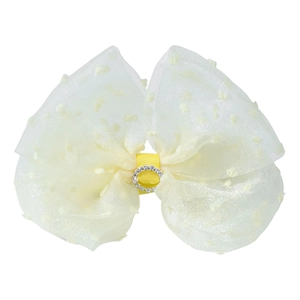 Detail of light yellow organza bow hair clip with white polka dots and rhinestone center