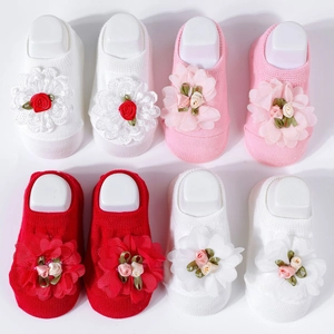 Detailed set of baby socks in white, pink, and red with large 3D chiffon lace flowers