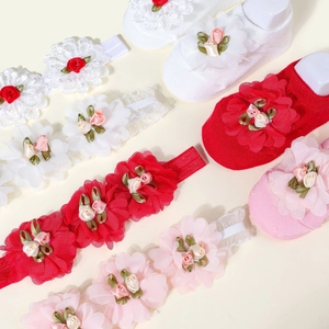 Baby flower headband and socks set in red, white, and pink with delicate floral lace trim