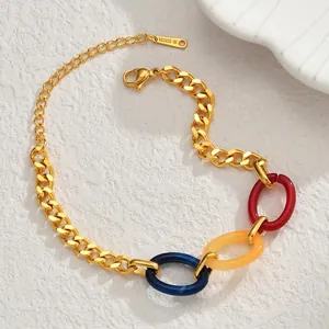 Gold stainless steel Cuban chain bracelet with colorful resin rings and lobster clasp