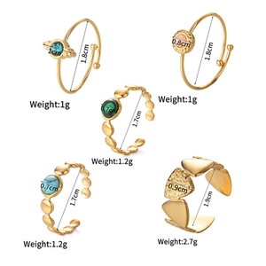 Detailed size and weight guide for gold rings with stars and colorful gemstones