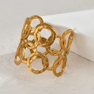 Vintage geometric open bangle in gold finish with hammered texture and hollow honeycomb design