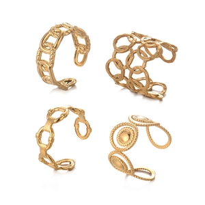 Set of four vintage geometric gold-plated open rings with various chain and hollow textures