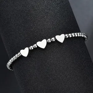 Elegant silver stainless steel beaded bracelet featuring three polished heart pendants for women