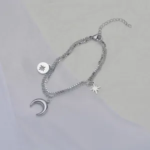 Double-layered stainless steel moon and star bracelet with polished silver finish pendants