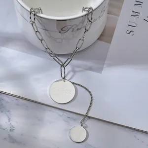 Minimalist silver stainless steel long necklace with round pendants and tassel detail