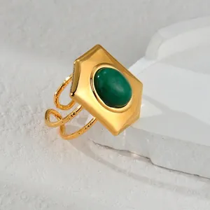 Vintage 18k gold plated stainless steel open ring featuring a green oval stone